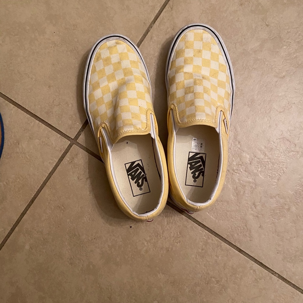 Yellow and white checkered slip on vans